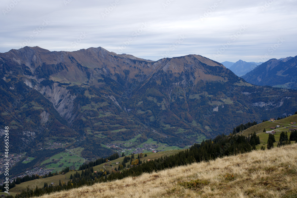 Mountain panorama seen from Axalp at Bernese Highlands on a grey cloudy autumn day. Photo taken October 19th, 2021, Brienz, Switzerland.