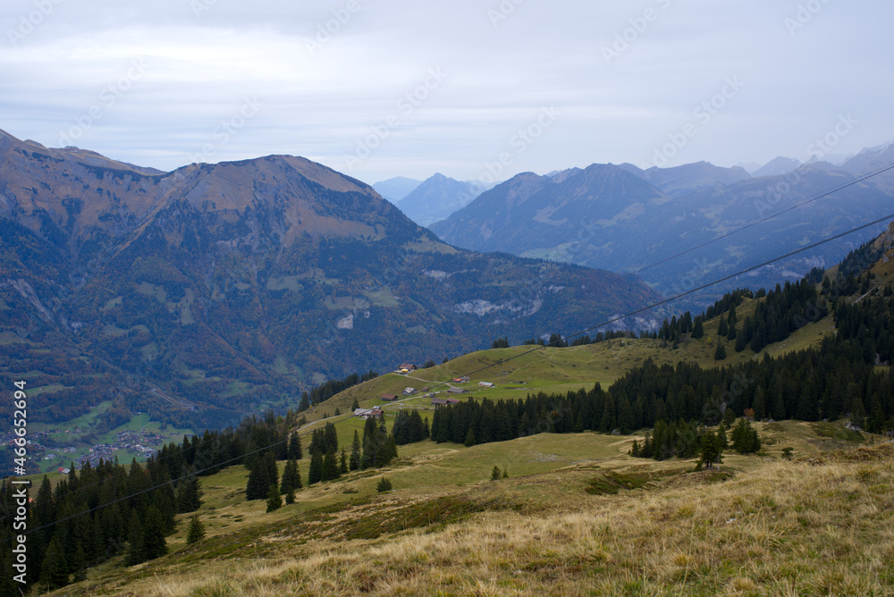 Fototapeta premium Mountain panorama seen from Axalp at Bernese Highlands on a grey cloudy autumn day. Photo taken October 19th, 2021, Brienz, Switzerland.