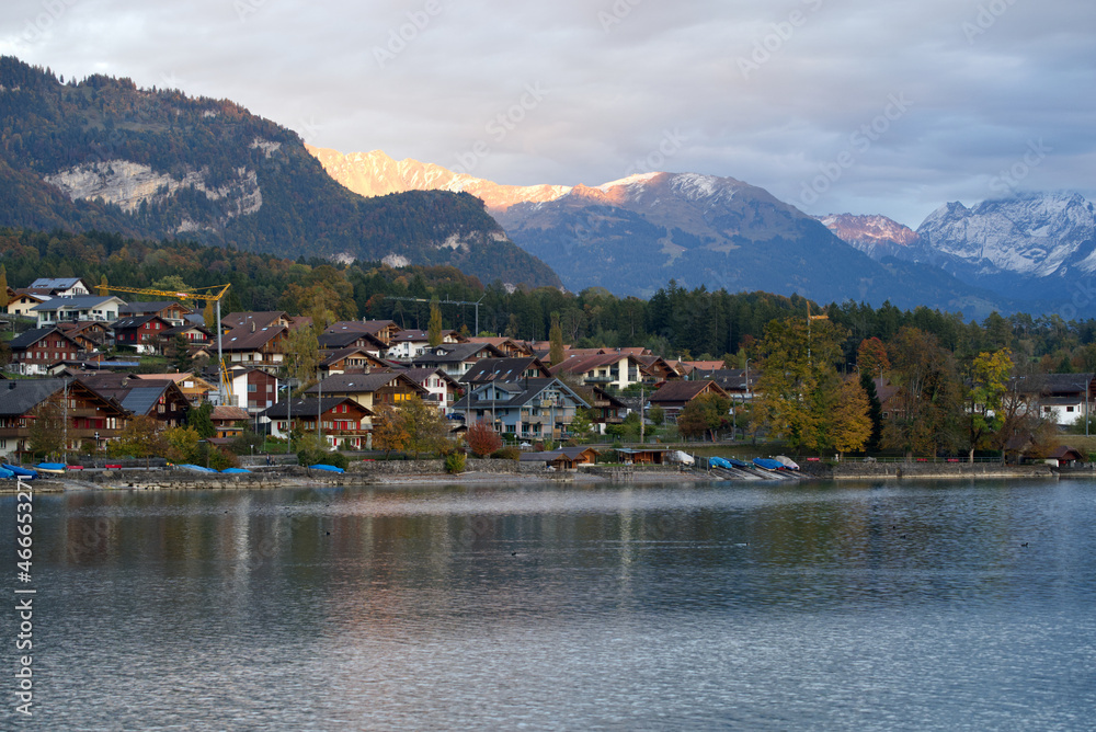Sunset seen from village Brienz, Canton Bern, on a grey cloudy autumn evening with scenic mountain panorama in the background. Photo taken October 19th, 2021, Brienz, Switzerland.