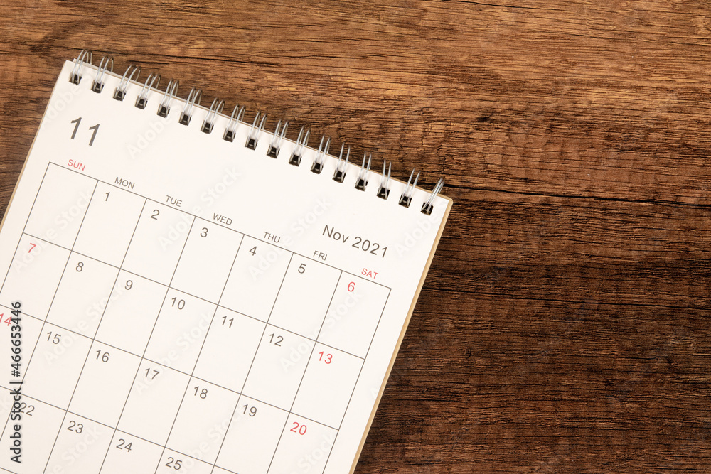 Calendar desk 2021 on November month, Top view calendar for organizer to planning on wooden table background. Calendar desk 2021 on November month, Top view calendar for organizer to planning on wooden table background.