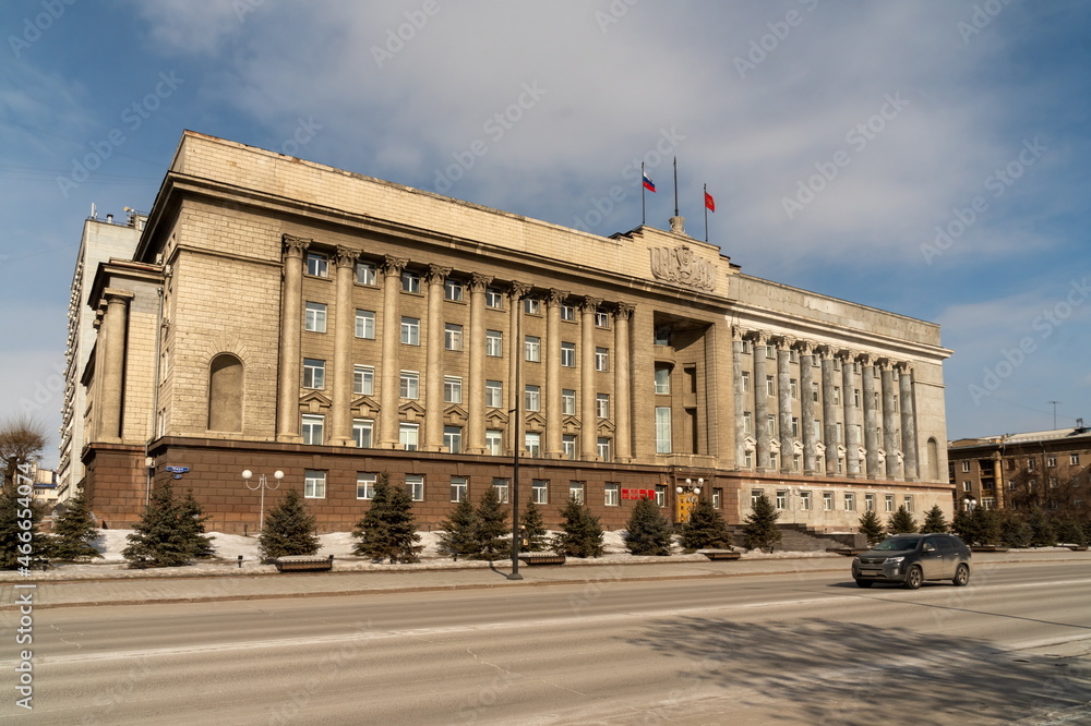 Fototapeta premium The building of the Krasnoyarsk Territory administration, formerly the House of Soviets, in the process of restoration, on Mira Avenue, in the spring.