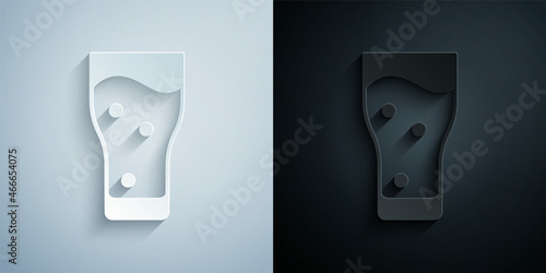 Paper cut Glass of beer icon isolated on grey and black background. Paper art style. Vector