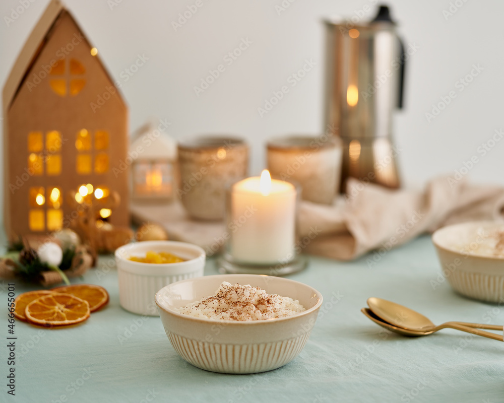 Christmas food. Rice pudding. French milk rice dessert. Healthy Vegan diet breakfast with coconut milk, cinnamon. Christmas cozy atmosphere of brunch or breakfast at home with decoration Christmas food. Rice pudding. French milk rice dessert. Healthy Vegan diet breakfast with coconut milk, cinnamon. Christmas cozy atmosphere of brunch or breakfast at home with decoration
