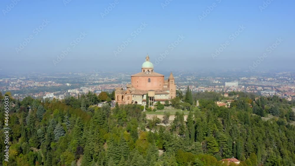 Sanctuary of the Madonna di San Luca, Bologna, Emilia-Romagna, Italy, October 2021. Drone orbits the church while gradually ascending from the south with the city in the distance. Sanctuary of the Madonna di San Luca, Bologna, Emilia-Romagna, Italy, October 2021. Drone orbits the church while gradually ascending from the south with the city in the distance.