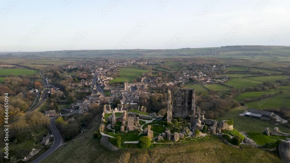 Panoramic view of Colfe Castle ruins during golden hour, County Dorset in England. Aerial sideways Panoramic view of Colfe Castle ruins during golden hour, County Dorset in England. Aerial sideways