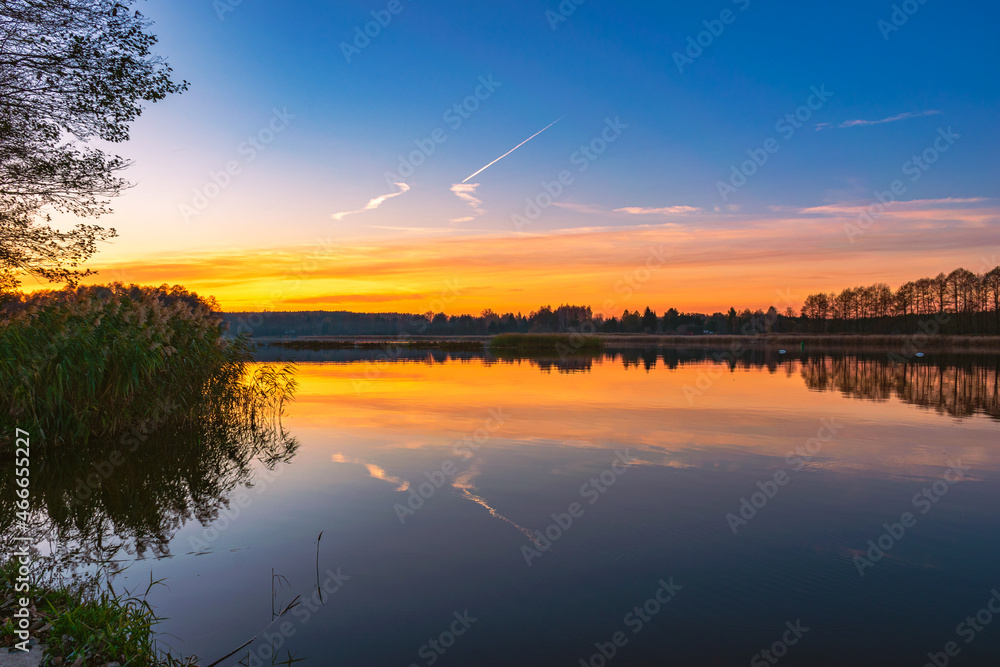 Golden hour and sunset over the Narew River in the autumn time Golden hour and sunset over the Narew River in the autumn time