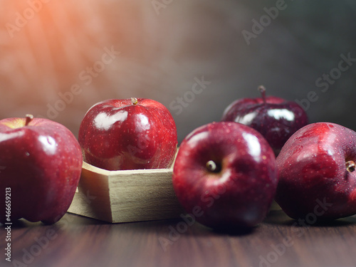 red apples on wooden table