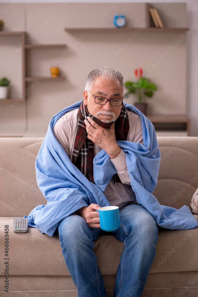 Fototapeta premium Old man suffering at home
