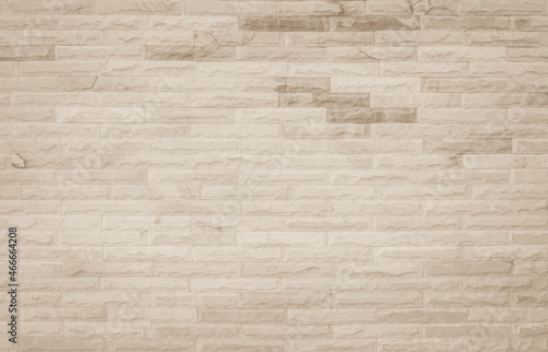 Empty background of wide cream brick wall texture. Beige old brown brick wall concrete or stone textured wallpaper backdrop.