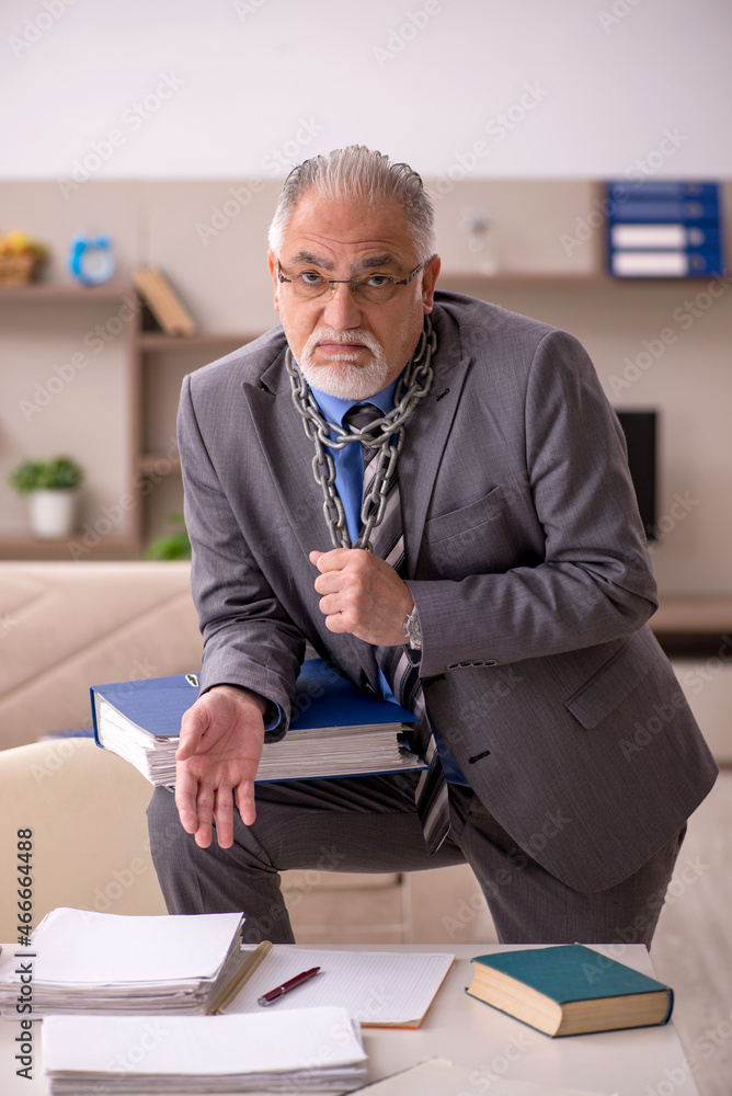 Old male employee working from home during pandemic Old male employee working from home during pandemic