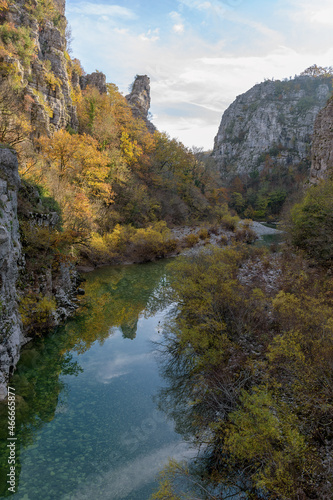 view from Kokori's old arch stone bridge (Noutsos) during fall season situated on the river of Voidomatis in Zagori, Epirus Greece.