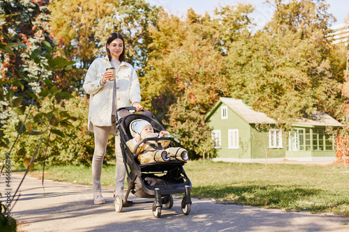Mom on maternity leave walks with the child in the park. © Svitlana