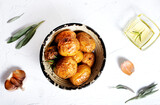 Rustic oven baked potatoes with rosemary in bowl