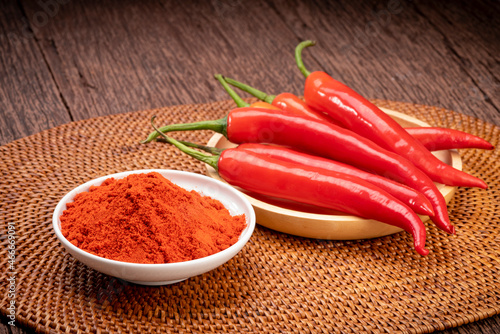 Korean pepper and red pepper in wooden plate, Korean chili powder on a wooden table background.
