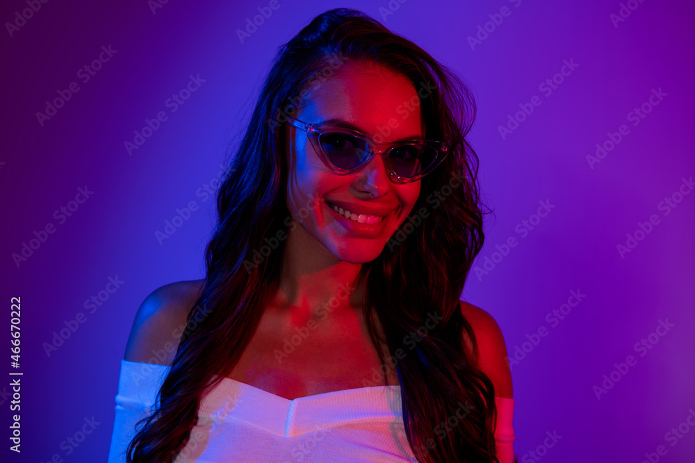 Photo of stunning mysterious lady toothy smile wear sunglass shirt isolated dark neon gradient color background Photo of stunning mysterious lady toothy smile wear sunglass shirt isolated dark neon gradient color background
