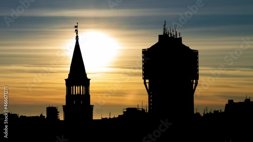 Skyline of Milan with Unusual strange building, Time Lapse at Sunset, Italy photo