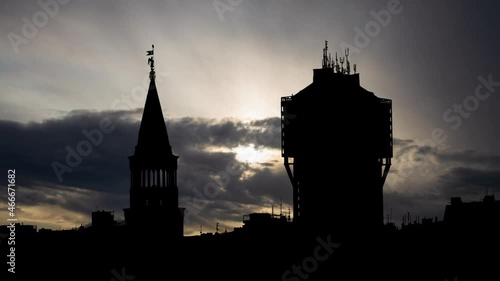 Torre Velasca and Milan skyline from Duomo roof terrace, Time Lapse at Sunrise with Fast Clouds, Italy photo