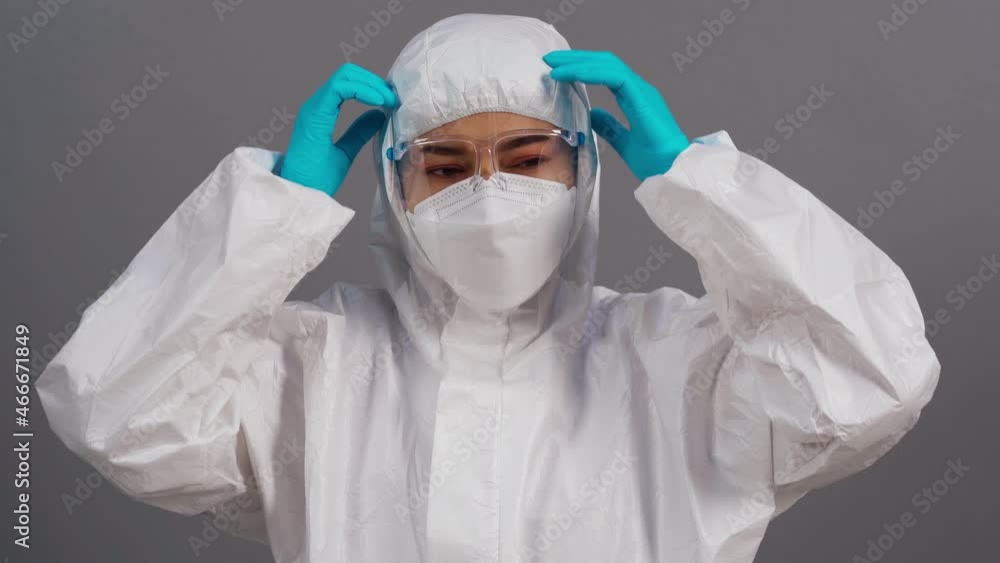 stressed doctor in protective PPE suit during coronavirus(covid-19) pandemic stressed doctor in protective PPE suit during coronavirus(covid-19) pandemic