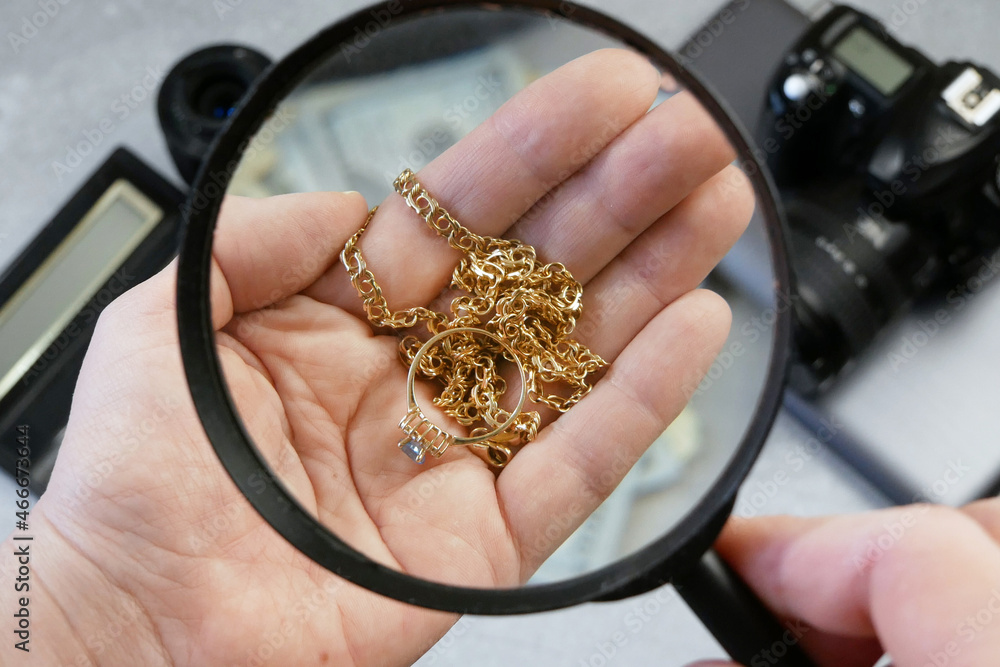 Pawn shop worker verify jewellery and photo or video camera and give money.  Customers Buy and Sell Precious Metals, Jewels, Ancient Coins and Second  Hand Electric Appliances Photos | Adobe Stock