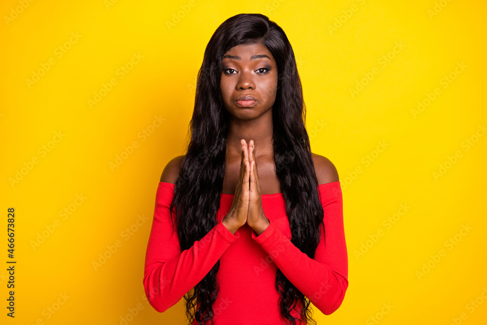Fototapeta premium Portrait of attractive depressed wavy-haired girl begging you favor isolated over bright yellow color background