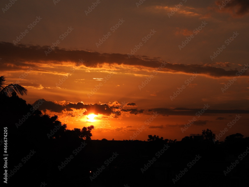 Orange Sun set with black clouds