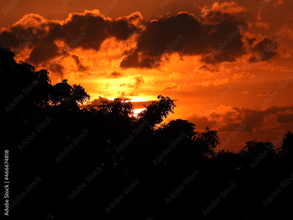 Orange Sun set with black clouds