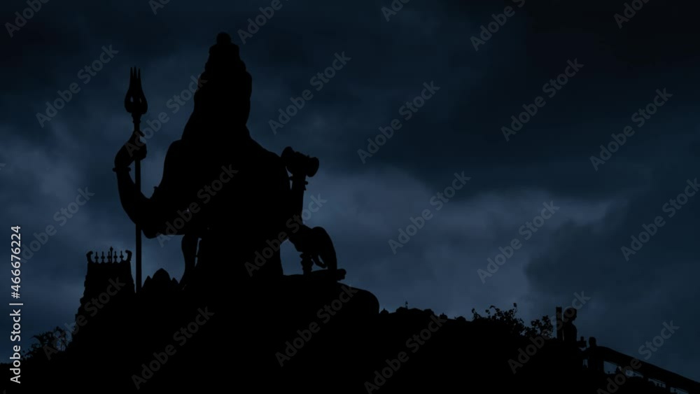 Hinduism Temple with Lightning and thunderstorm flash over Lord Shiva God in Silhouette Hinduism Temple with Lightning and thunderstorm flash over Lord Shiva God in Silhouette