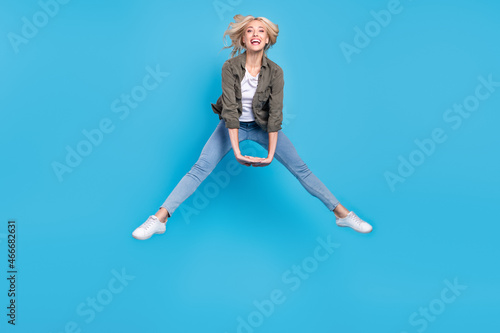 Full length body size photo woman jumping up childish isolated pastel blue color background