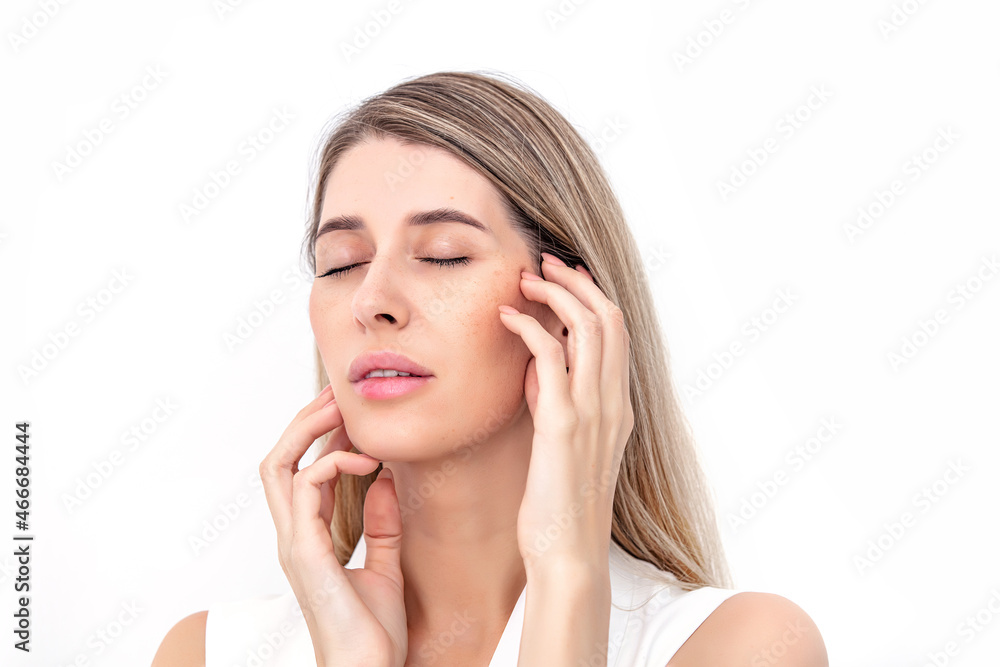 Portrait of a beautiful blonde woman with natural makeup on a white background. Studio shot. Portrait of a beautiful blonde woman with natural makeup on a white background. Studio shot.
