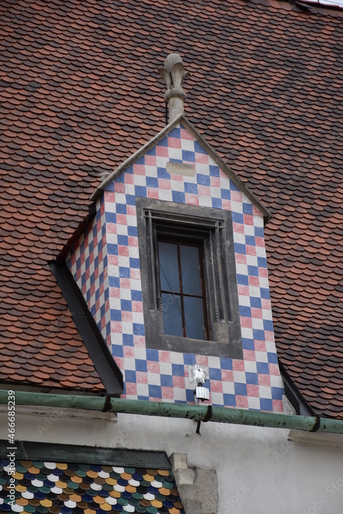 Fototapeta premium Unusual window with nice blue, white and red colour in the city centre.