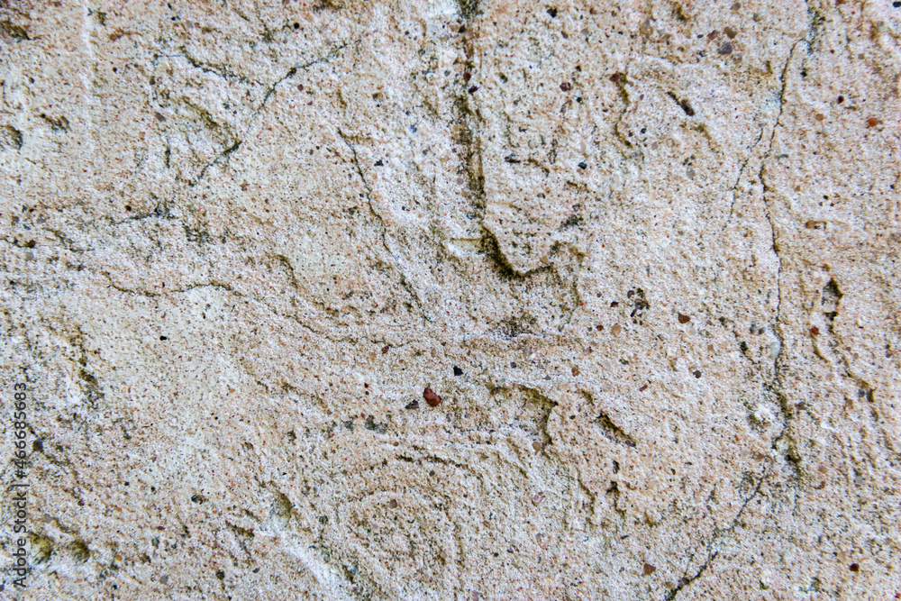 Texture of rough gray-pink cement plaster with holes and cracks. Texture. Background. Texture of rough gray-pink cement plaster with holes and cracks. Texture. Background.