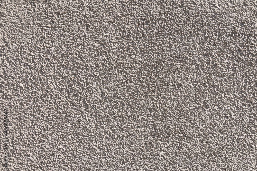 Gray concrete wall texture and background. Gray cement, grit, plaster. Corrugated, rough surface. Gray concrete wall texture and background. Gray cement, grit, plaster. Corrugated, rough surface.
