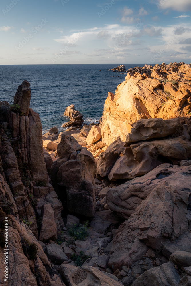 Amazing and spectacular rock formations at the coast of Sardinia, Italy in a hot summer day