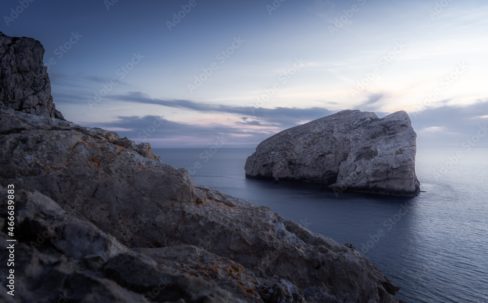 Blue hour at a rocky coast in Sardinia, Italy in summer