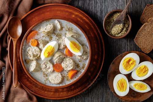 Zurek polish soup with white kielbasa on a bowl photo