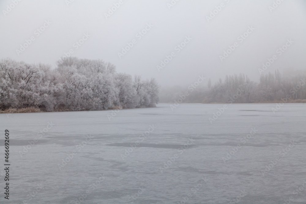 Fototapeta premium Fog over frozen river