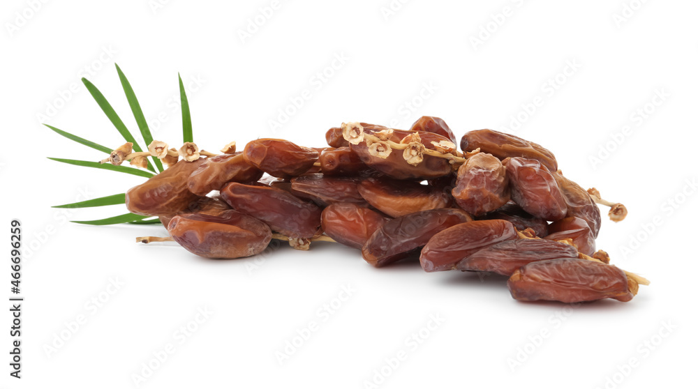 Sweet dates on branches and green leaves against white background. Dried fruit as healthy snack Sweet dates on branches and green leaves against white background. Dried fruit as healthy snack