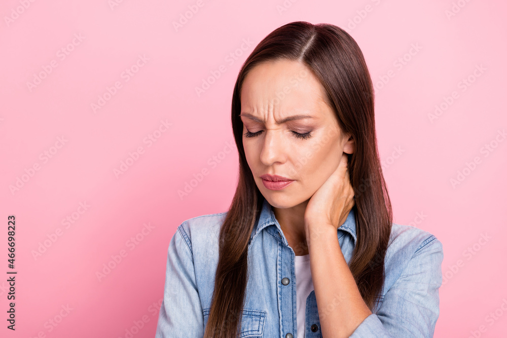Fototapeta premium Photo of sad mature lady feel sick wear jeans shirt isolated over pink color background