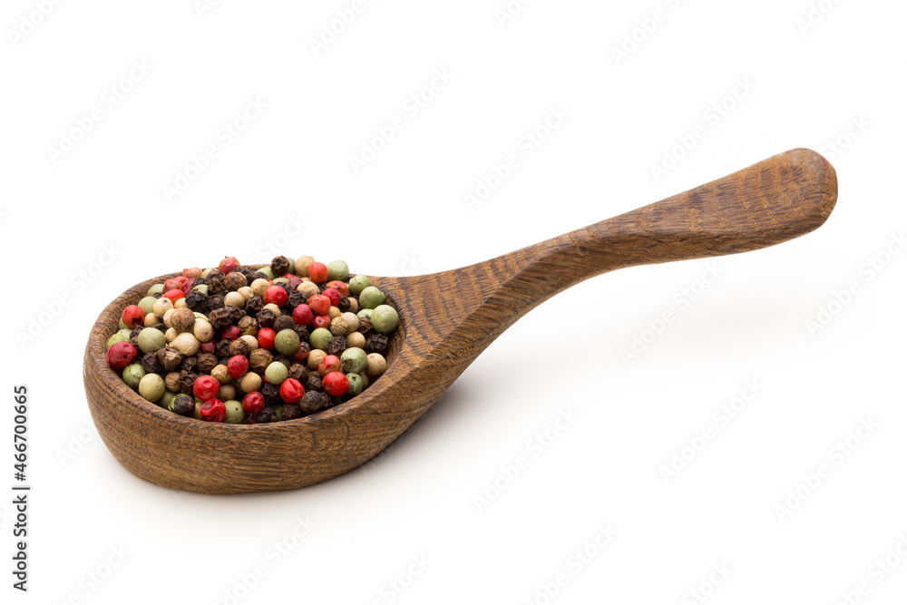 Pepper mix seed on spoon on white background.