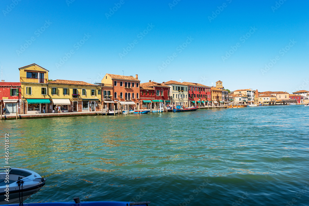 Downtown of Murano island. Canal with moored boats and old houses on waterfront. Venetian lagoon, Venice, UNESCO world heritage site, Veneto, Italy, Europe. 