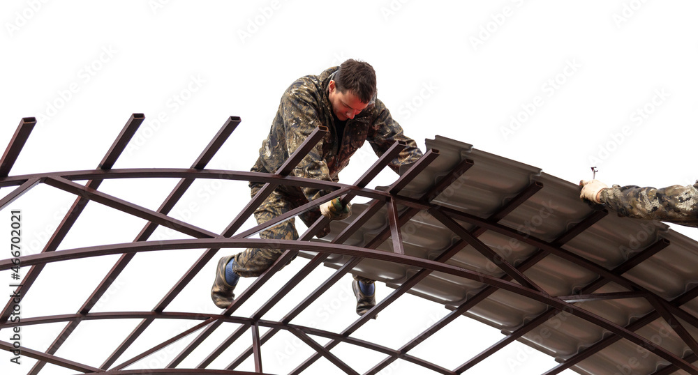 Workers are installing a metal canopy. Workers are installing a metal canopy.