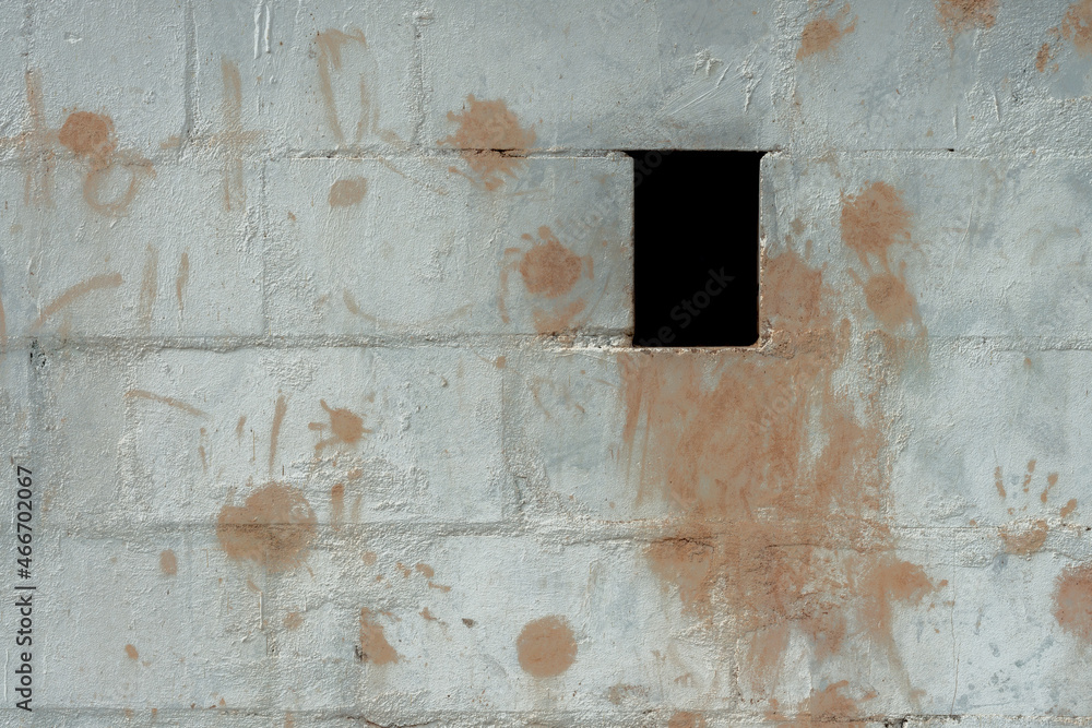 A white structured brick wall with color splashes A white structured brick wall with color splashes