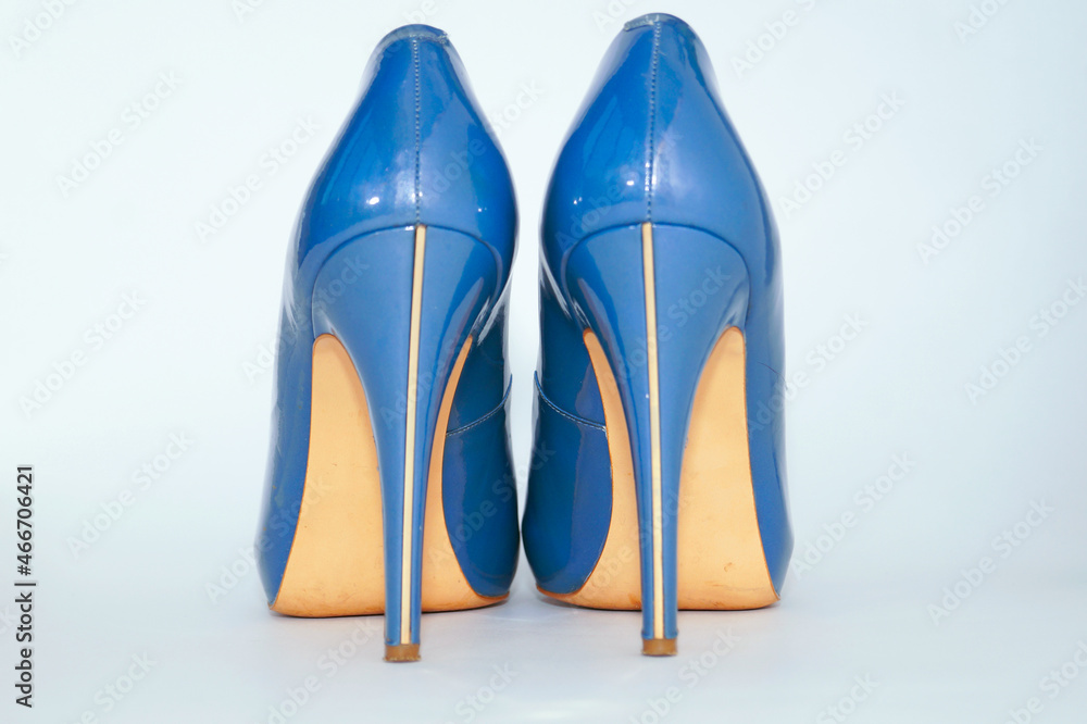 Blue sexy high-heeled shoes on a white background. Blue sexy high-heeled shoes on a white background.