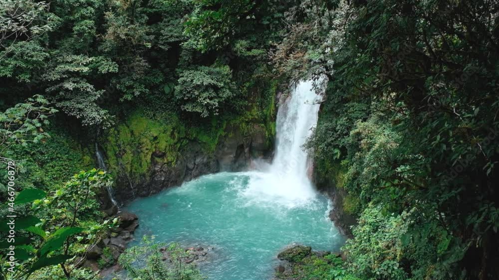 Pan up of the waterfall in Rio Celeste in Costa Rica Pan up of the waterfall in Rio Celeste in Costa Rica