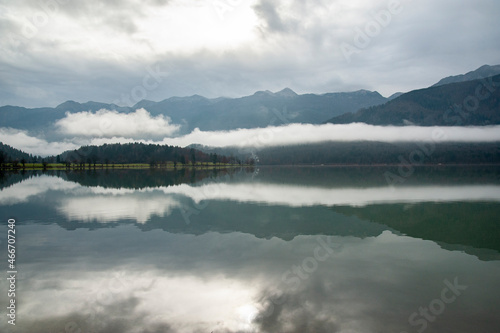 Reflections in the Bohinj lake on a cloudy day
