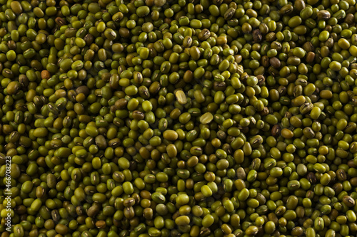 Agricultural products background. Texture of green beans mung bean. Vegetarian and vegan organic food. Top view