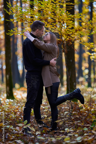 Young couple in the autumnal forest