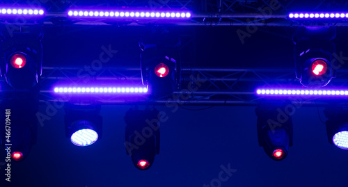 Blue-pink spotlights at a concert at night.
