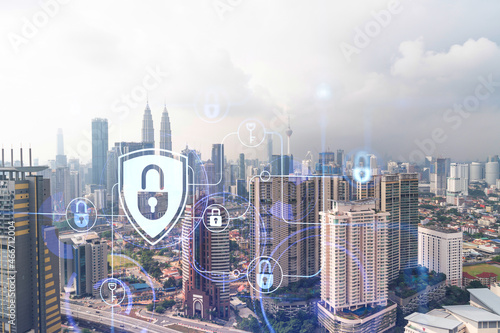 Canvas Print Hologram of padlock icons over panoramic city view of Kuala Lumpur to protect business, Malaysia, Asia