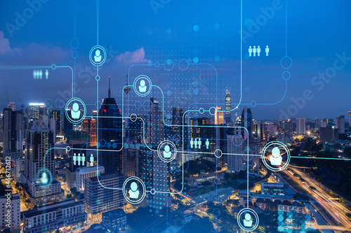 Photography Glowing social media icons on night panoramic city view of Kuala Lumpur, Malaysia, Asia